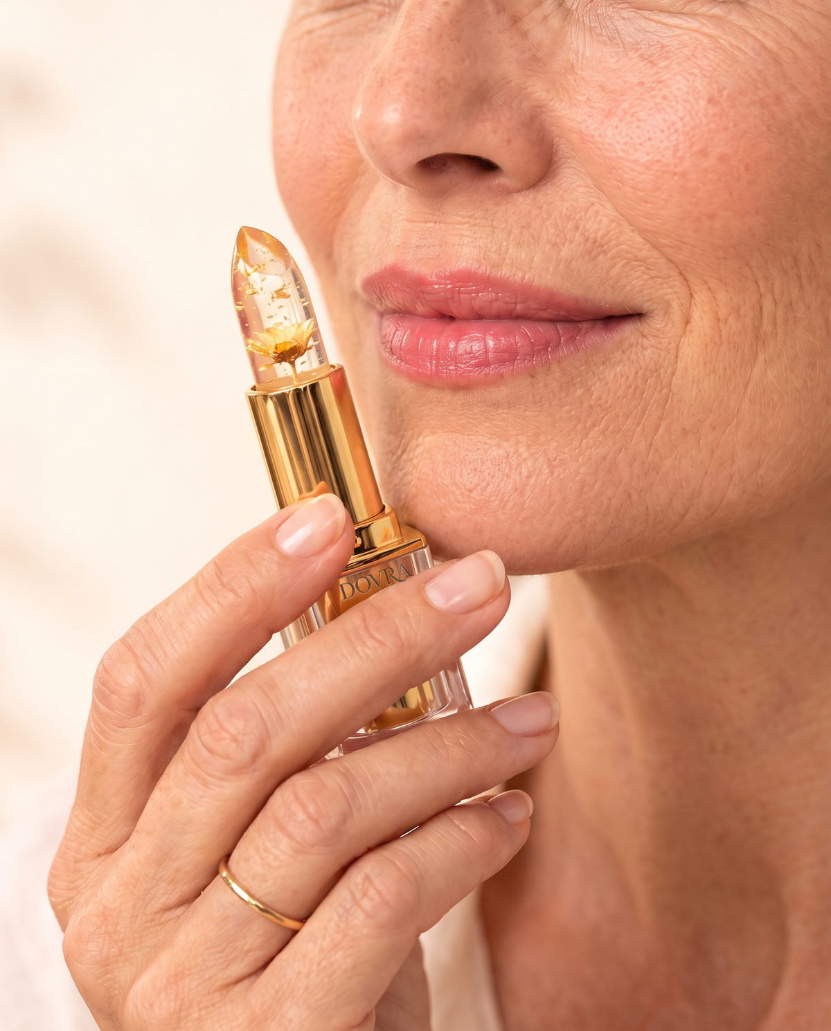 Dovra lipstick held near the lips
